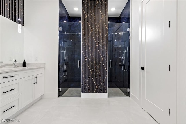 bathroom with vanity, recessed lighting, and a shower stall