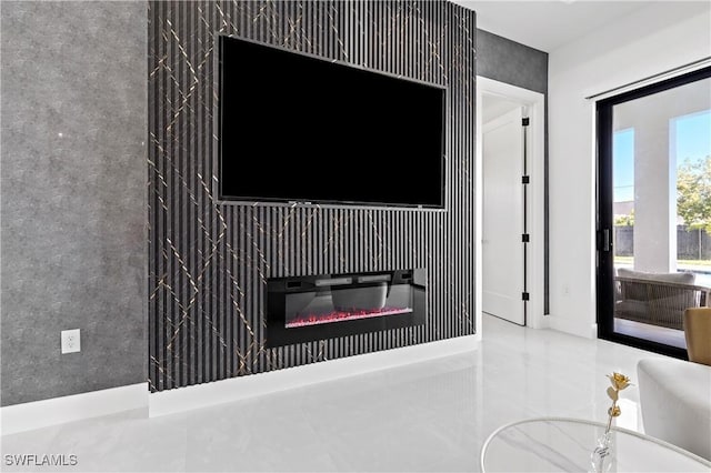 interior details with a glass covered fireplace