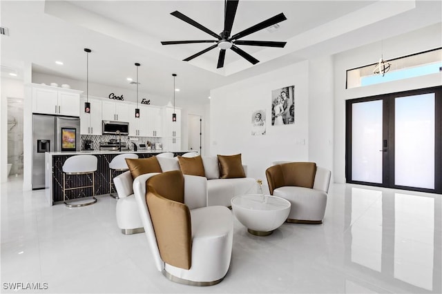 living room with light tile patterned floors, a ceiling fan, recessed lighting, and french doors