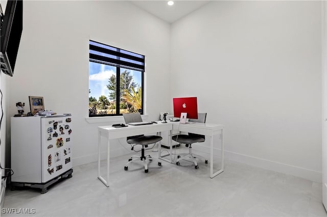 office with recessed lighting and baseboards