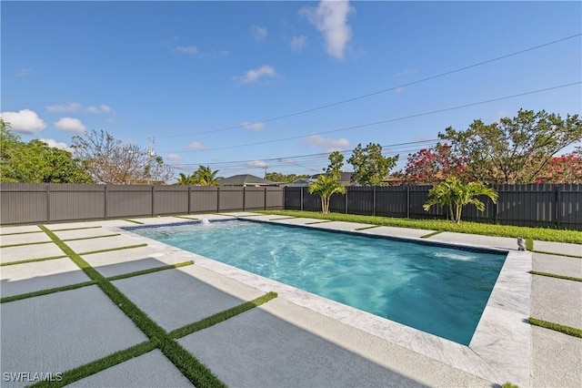 view of swimming pool with a fenced in pool, a fenced backyard, and a patio area