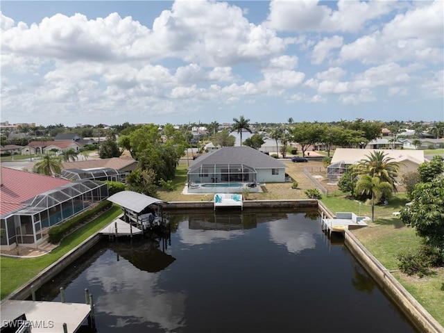 view of dock featuring a water view, glass enclosure, and a residential view
