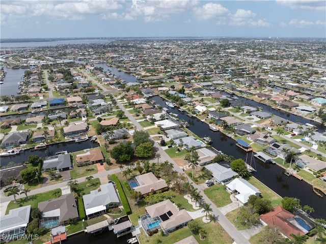 birds eye view of property featuring a residential view and a water view