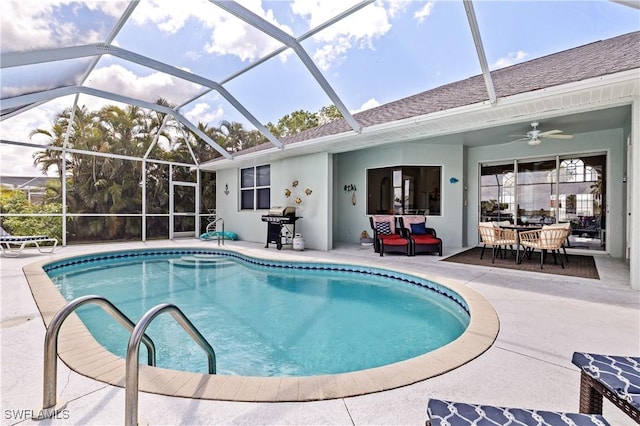 outdoor pool featuring grilling area, outdoor dining area, a patio area, a ceiling fan, and glass enclosure