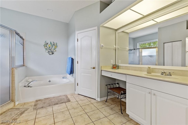 bathroom with vanity, a bath, tile patterned floors, and a shower stall