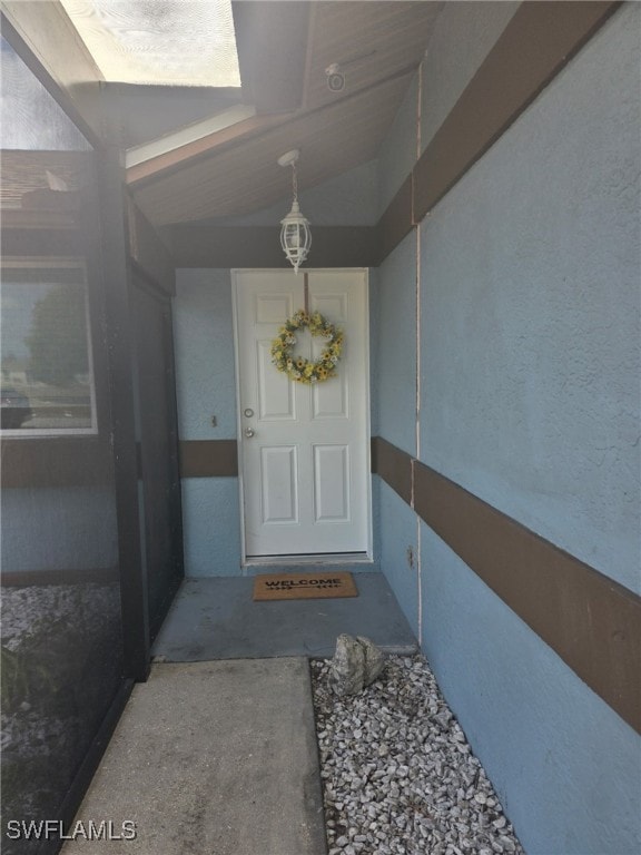2123 NE 6th Pl, Cape Coral, FL 33909 - doorway to property with stucco siding