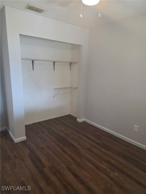 2123 NE 6th Pl, Cape Coral, FL 33909 - unfurnished bedroom with baseboards, visible vents, dark wood-style floors, and a closet