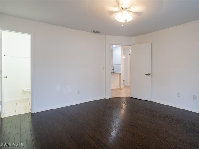 1228 SE 24th Ave Unit A, Cape Coral, FL 33990 - unfurnished room with wood finished floors, ceiling fan, and baseboards