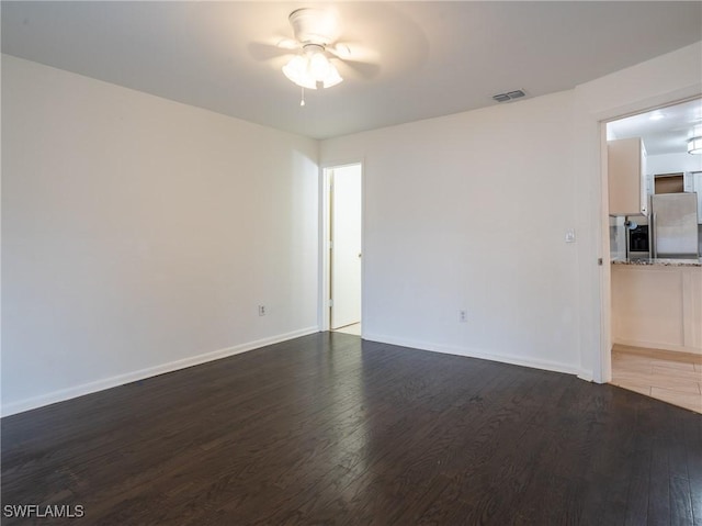 1228 SE 24th Ave Unit A, Cape Coral, FL 33990 - unfurnished room with a ceiling fan, wood finished floors, and baseboards