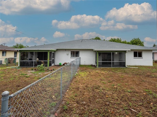 1228 SE 24th Ave Unit A, Cape Coral, FL 33990 - rear view of house featuring a sunroom and stucco siding