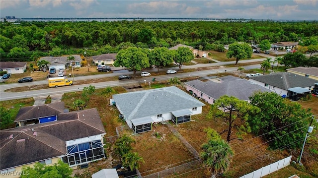 1228 SE 24th Ave Unit A, Cape Coral, FL 33990 - aerial perspective of suburban area featuring a heavily wooded area