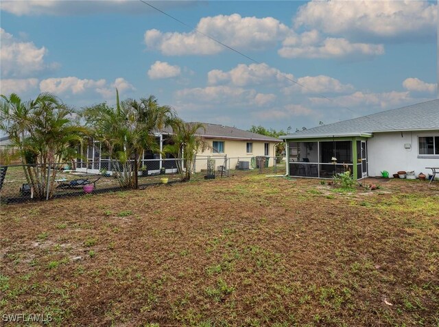 1228 SE 24th Ave Unit A, Cape Coral, FL 33990 - view of yard with a sunroom