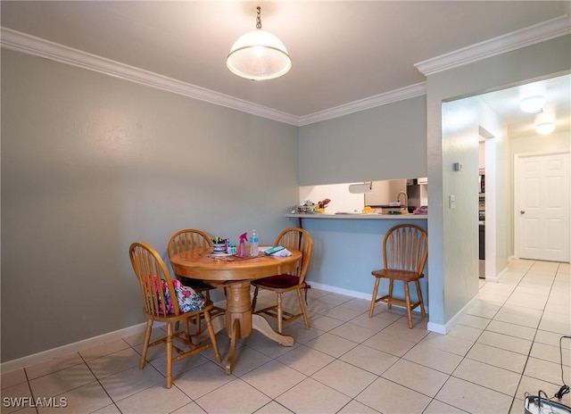 1228 SE 24th Ave Unit A, Cape Coral, FL 33990 - dining space with ornamental molding, light tile patterned flooring, and baseboards