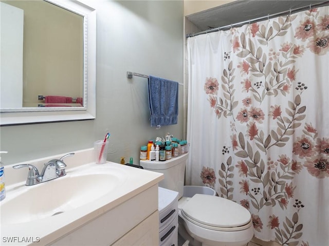 1228 SE 24th Ave Unit A, Cape Coral, FL 33990 - bathroom with vanity, toilet, and a shower with shower curtain