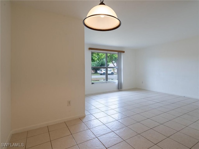 1228 SE 24th Ave Unit A, Cape Coral, FL 33990 - spare room featuring light tile patterned floors and baseboards