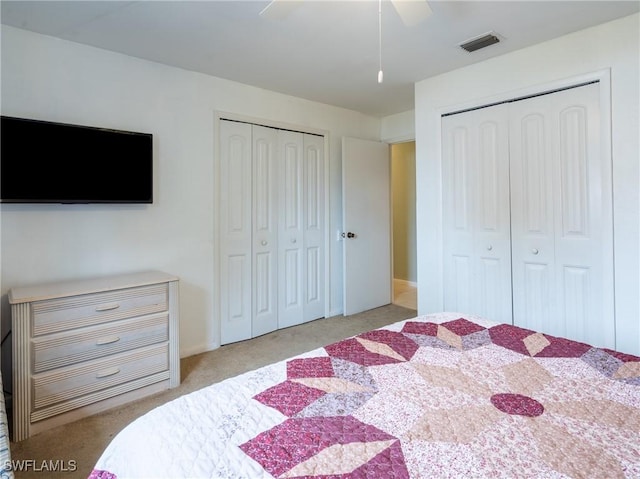 1228 SE 24th Ave Unit A, Cape Coral, FL 33990 - bedroom with multiple closets, light carpet, and ceiling fan