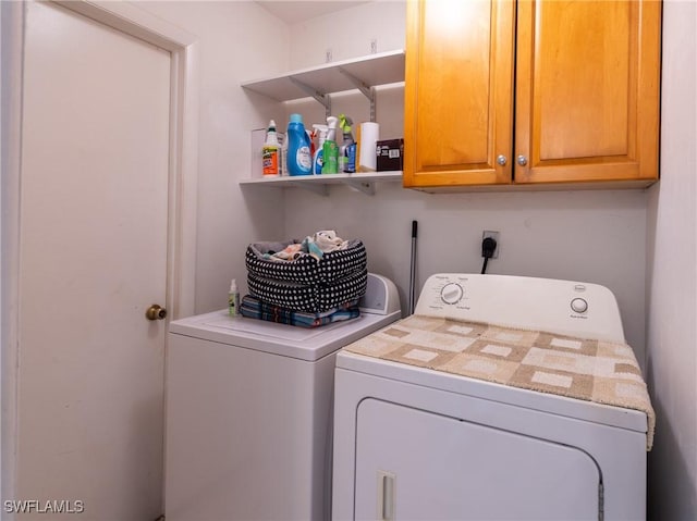 1228 SE 24th Ave Unit A, Cape Coral, FL 33990 - laundry area with washing machine and clothes dryer and cabinet space