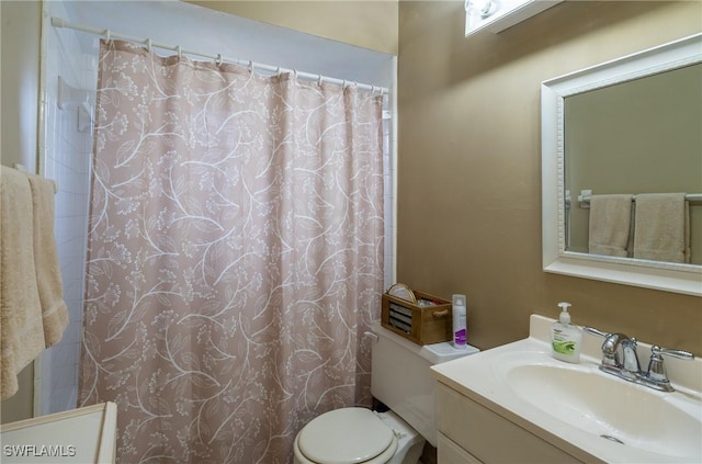 1228 SE 24th Ave Unit A, Cape Coral, FL 33990 - bathroom with toilet, vanity, and curtained shower