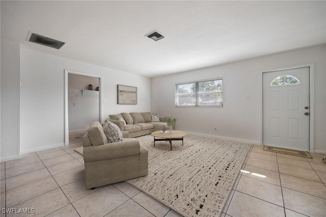 12955 First St, Fort Myers, FL 33905 - living room with visible vents, baseboards, and light tile patterned floors