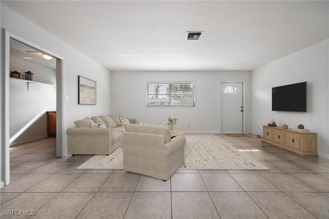 12955 First St, Fort Myers, FL 33905 - living room with light tile patterned floors, baseboards, and visible vents