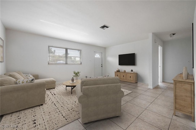 12955 First St, Fort Myers, FL 33905 - living area with visible vents, baseboards, and light tile patterned flooring