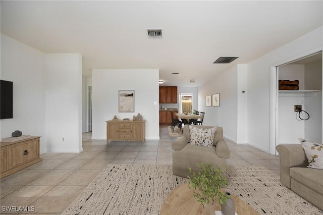 12955 First St, Fort Myers, FL 33905 - living room featuring visible vents, baseboards, and light tile patterned floors