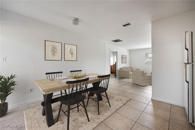 12955 First St, Fort Myers, FL 33905 - dining space featuring baseboards, visible vents, and light tile patterned floors