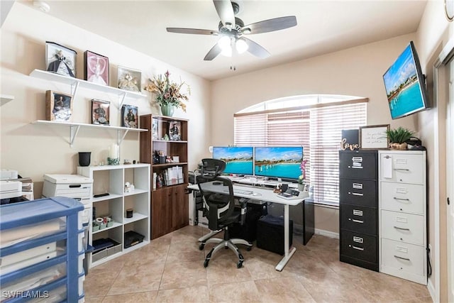 office area with ceiling fan and light tile patterned floors