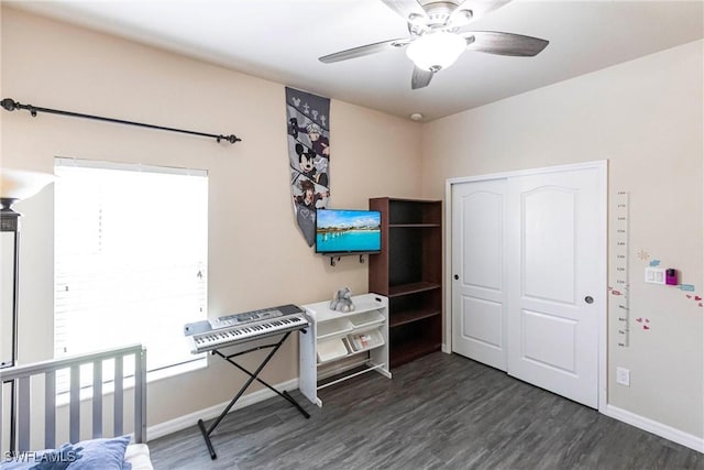 office with baseboards, ceiling fan, and wood finished floors