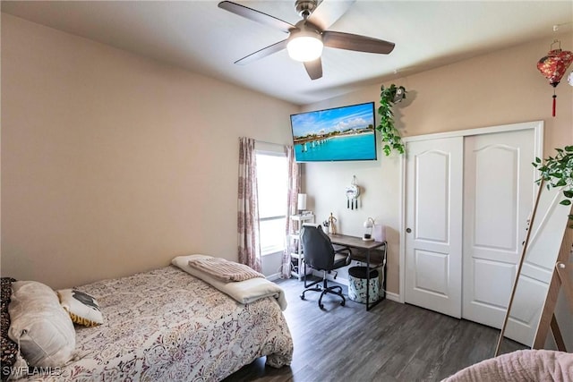 bedroom with a closet, baseboards, a ceiling fan, and dark wood-style flooring