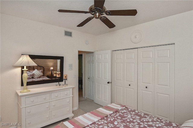 bedroom featuring visible vents, a ceiling fan, and a closet
