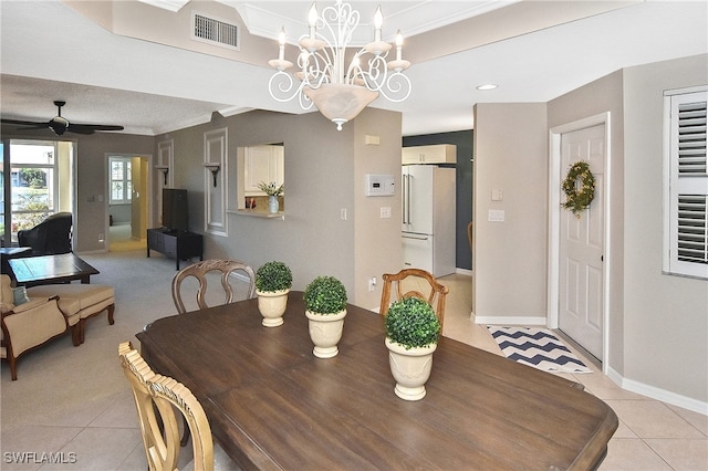 dining area with baseboards, visible vents, light tile patterned floors, and ceiling fan with notable chandelier