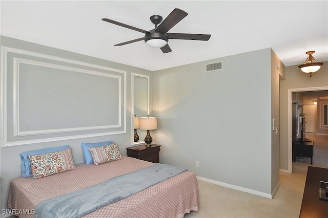 carpeted bedroom with a ceiling fan, baseboards, and visible vents