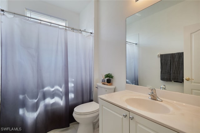 bathroom featuring vanity, a shower with curtain, and toilet