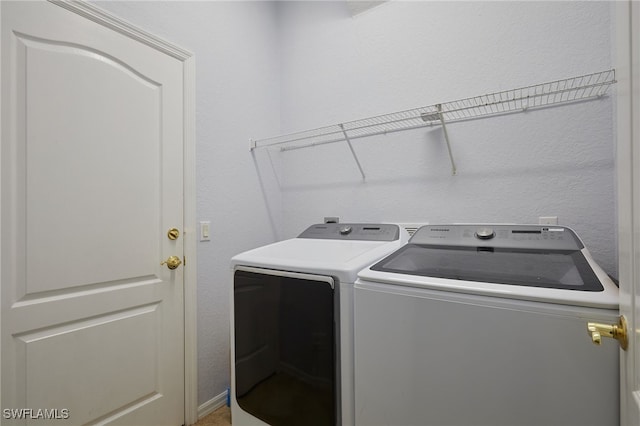 laundry area with independent washer and dryer and laundry area
