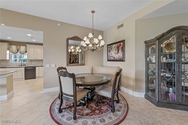 9030 Cascada Way Unit 102, Naples, FL 34114 - dining space with baseboards, visible vents, light tile patterned flooring, and a notable chandelier