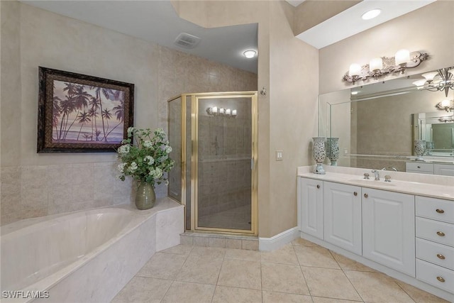9030 Cascada Way Unit 102, Naples, FL 34114 - bathroom with vanity, a stall shower, a bath, and tile patterned floors