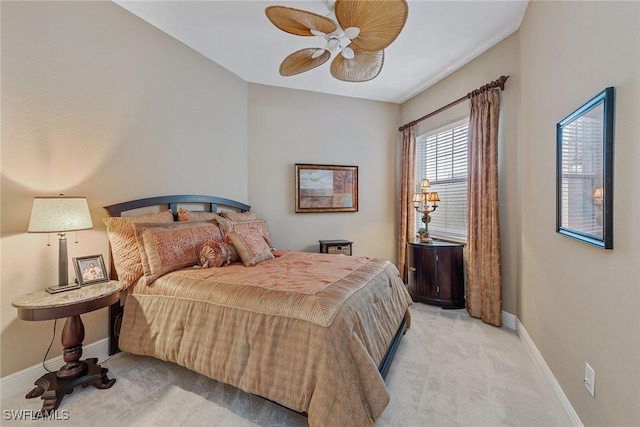 9030 Cascada Way Unit 102, Naples, FL 34114 - bedroom featuring light colored carpet, baseboards, and ceiling fan