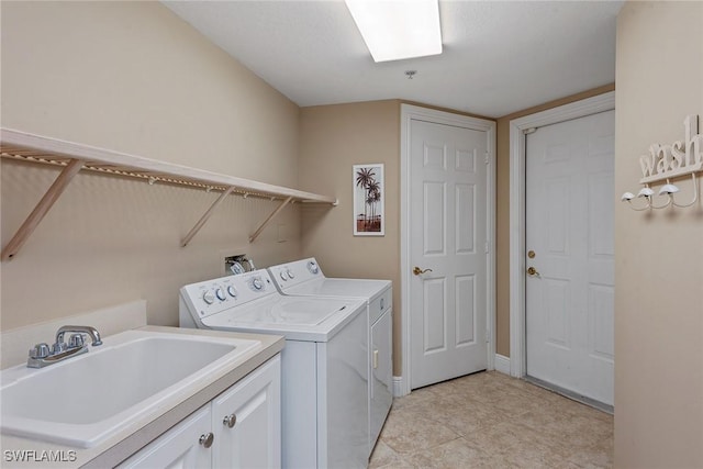 9030 Cascada Way Unit 102, Naples, FL 34114 - laundry area featuring a sink, light tile patterned floors, cabinet space, and washer and clothes dryer
