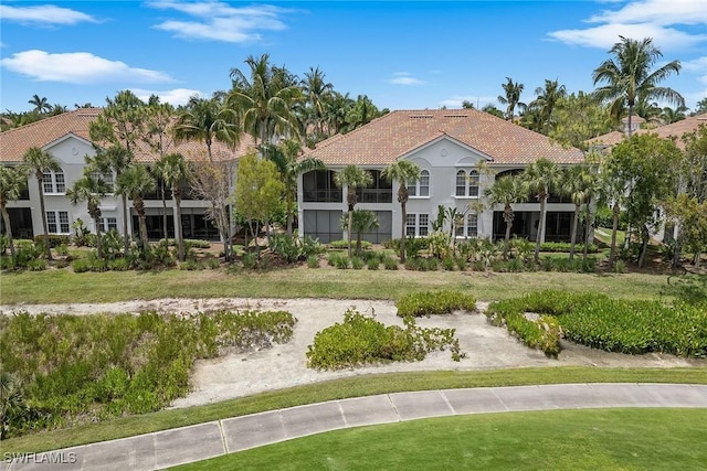 9030 Cascada Way Unit 102, Naples, FL 34114 - view of front facade with a tile roof and stucco siding