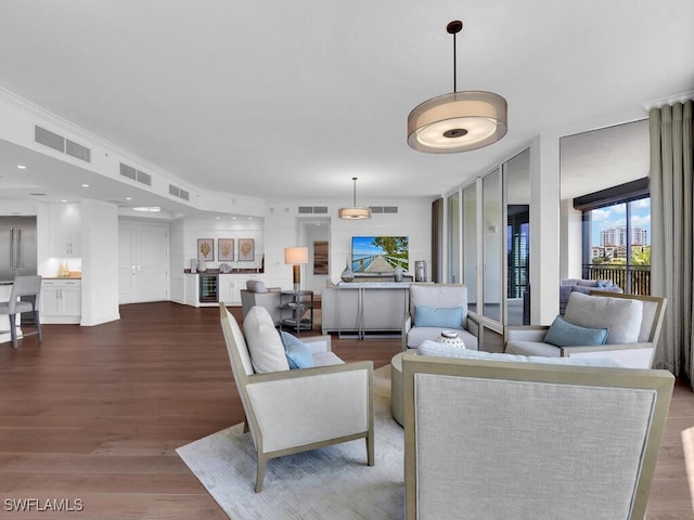 living area featuring floor to ceiling windows and dark wood-type flooring
