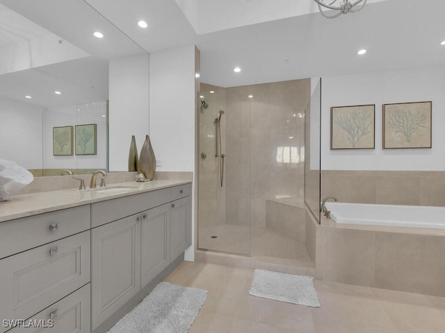 full bathroom featuring a tile shower, vanity, recessed lighting, tile patterned floors, and a bath