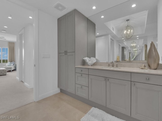 bathroom featuring a chandelier, baseboards, recessed lighting, vanity, and tile patterned floors