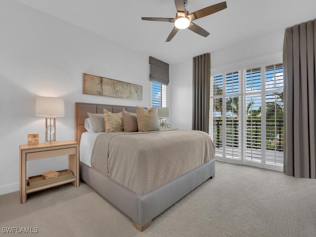 carpeted bedroom with access to outside and a ceiling fan