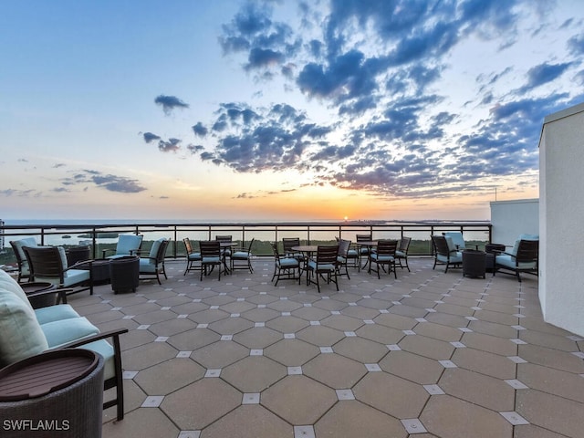 view of patio featuring outdoor lounge area and a water view