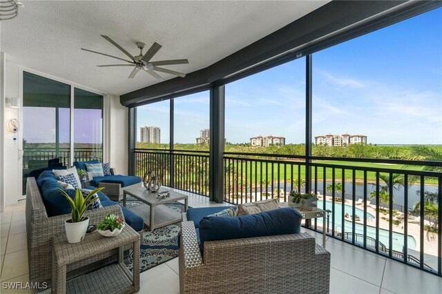 4800 Pelican Colony Blvd Unit 303, Bonita Springs, FL 34134 - sunroom / solarium with outdoor lounge area, a ceiling fan, floor to ceiling windows, tile patterned flooring, and a textured ceiling
