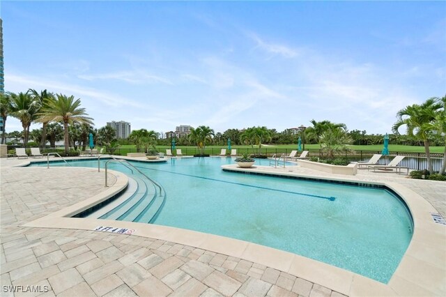 4800 Pelican Colony Blvd Unit 303, Bonita Springs, FL 34134 - community pool featuring a patio area