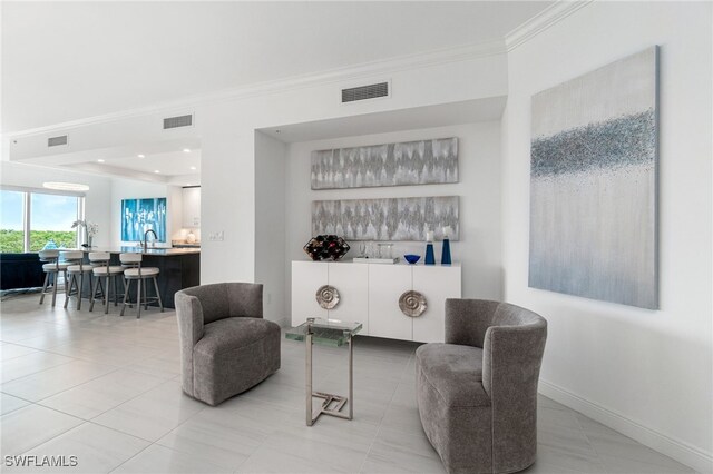 4800 Pelican Colony Blvd Unit 303, Bonita Springs, FL 34134 - sitting room featuring ornamental molding and light tile patterned flooring