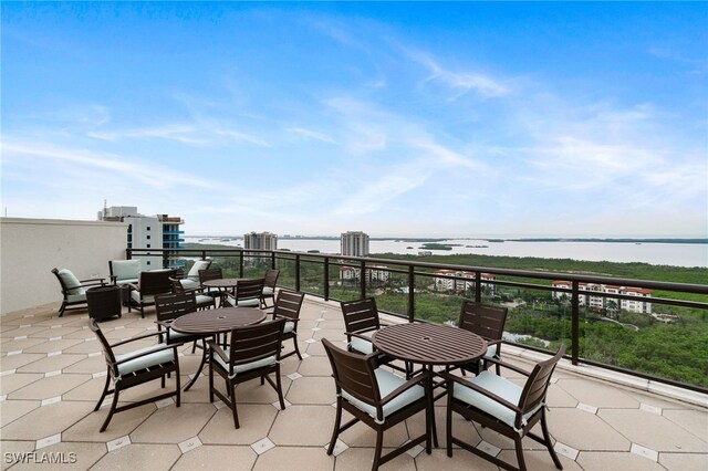 4800 Pelican Colony Blvd Unit 303, Bonita Springs, FL 34134 - view of patio / terrace with a water view