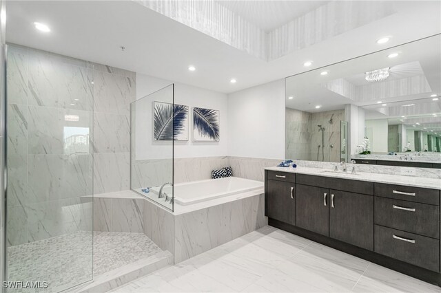 4800 Pelican Colony Blvd Unit 303, Bonita Springs, FL 34134 - bathroom featuring a garden tub, recessed lighting, vanity, a marble finish shower, and marble finish floors